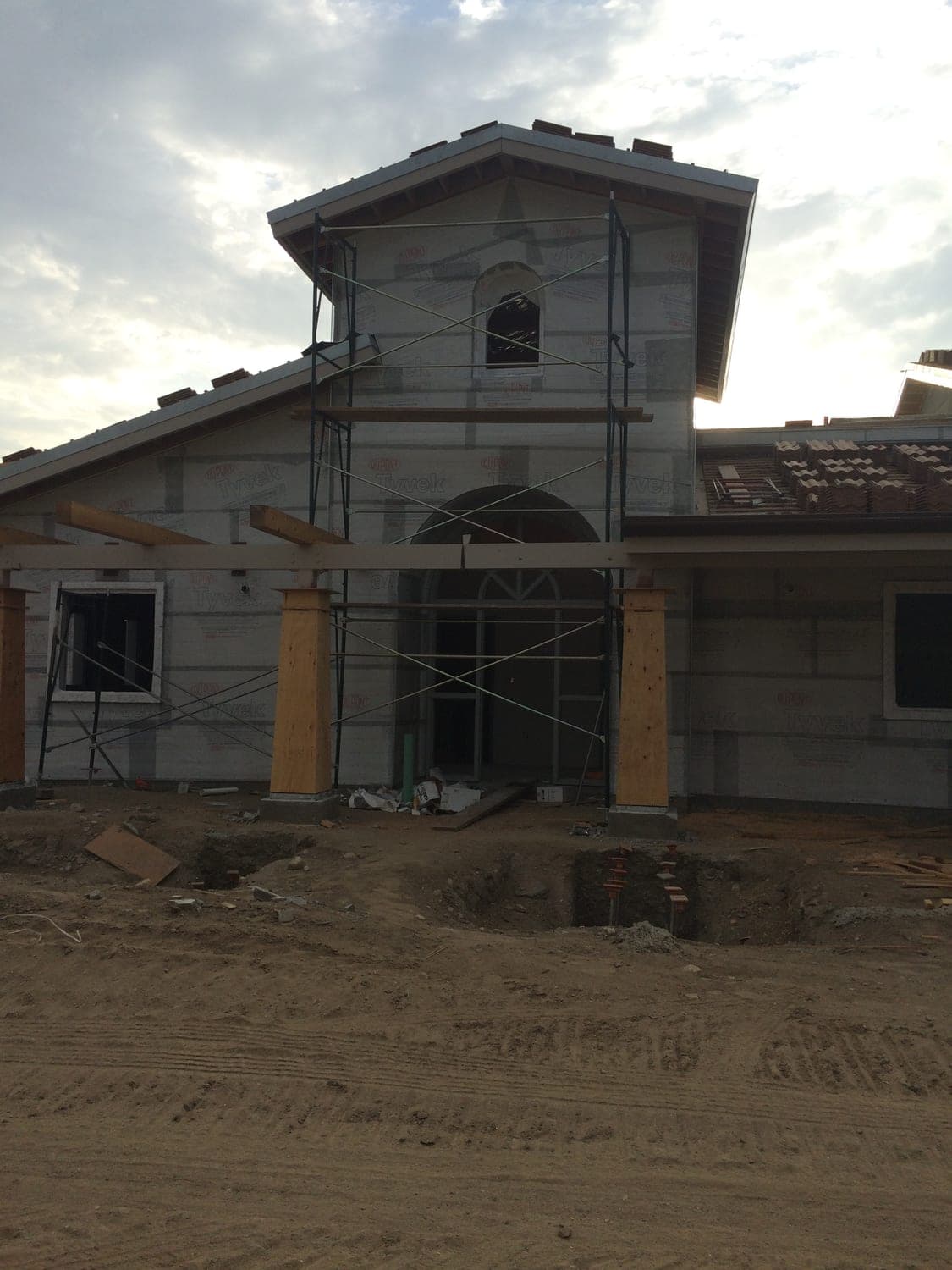 Mediterranean commercial building tower and entry during construction