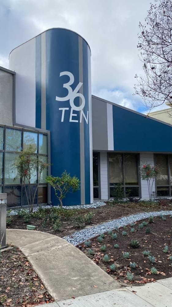 36 TEN commercial building with finished blue entry tower and new landscaping